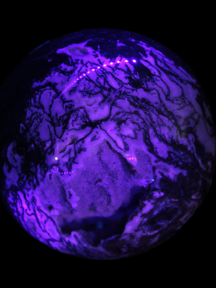 Ocean Moss Agate with geode cave sphere 4500g in UV light