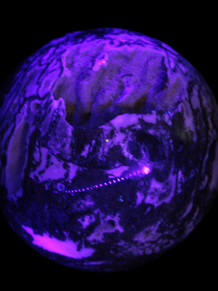 Ocean Moss Agate with geode cave sphere 4500g in UV light