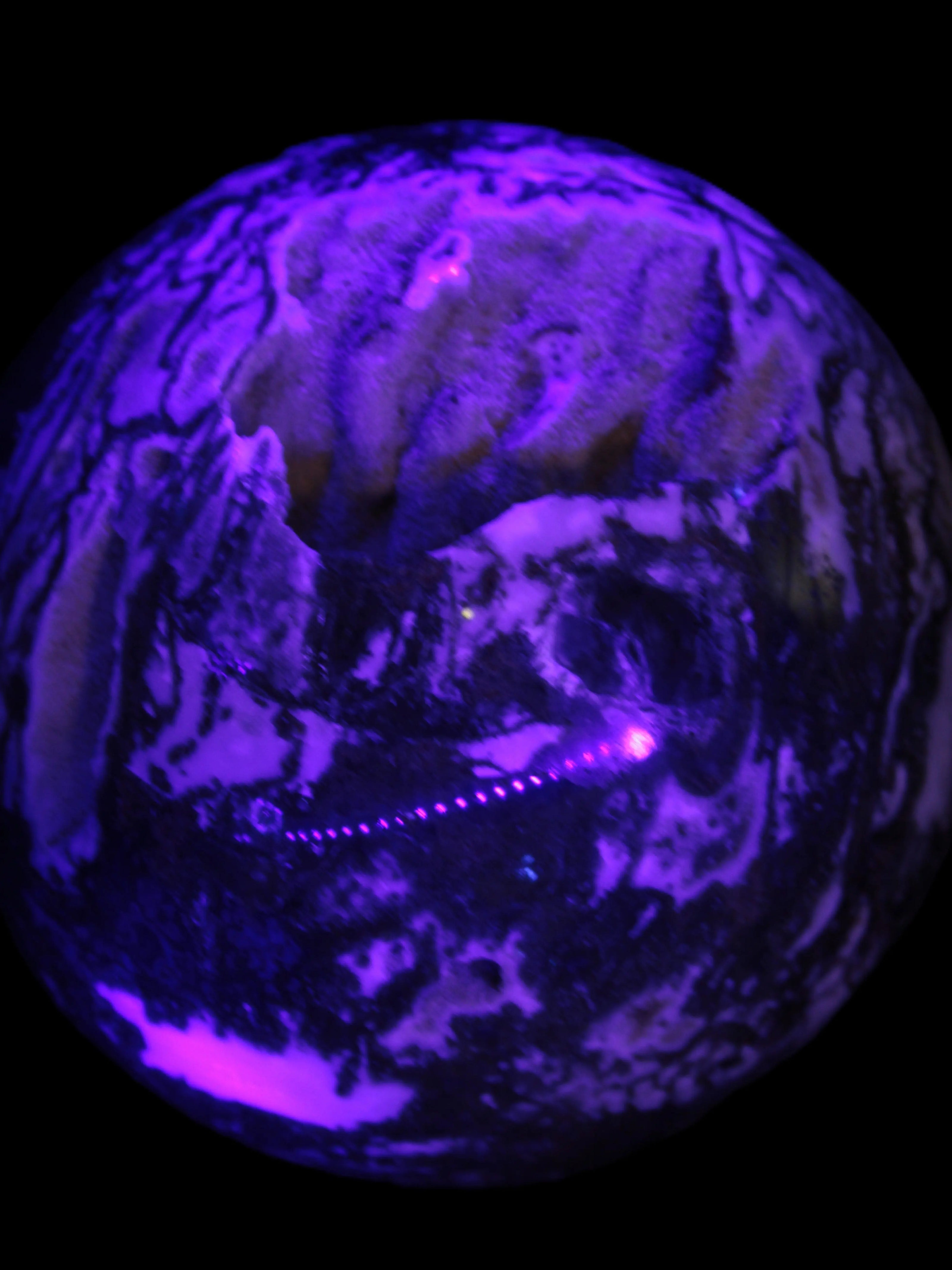 Ocean Moss Agate with geode cave sphere 4500g in UV light