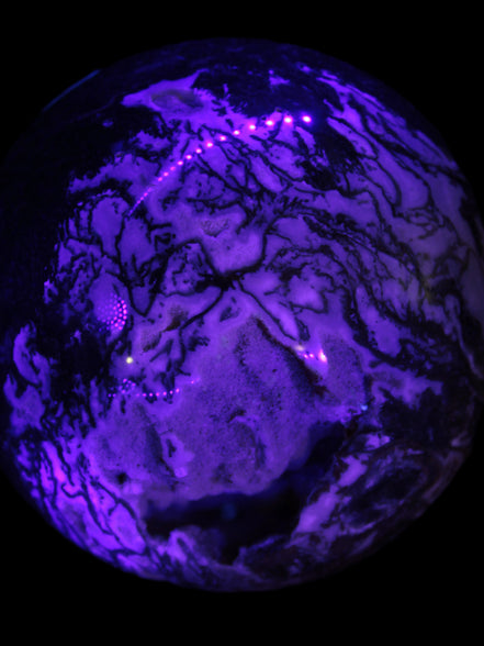Ocean Moss Agate with geode cave sphere 4500g in UV light