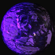 Ocean Moss Agate with geode cave sphere 4500g in UV light