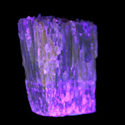 Amber Calcite phosphorescent crystal 127g in UV light - Rocks and Things Store