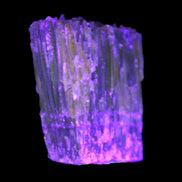 Amber Calcite phosphorescent crystal 127g in UV light - Rocks and Things Store