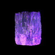 Amber Calcite phosphorescent crystal 127g in UV light - Rocks and Things Store