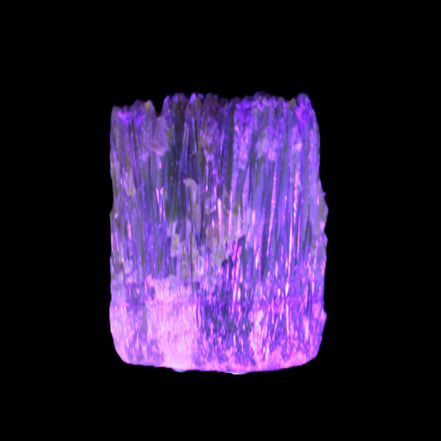 Amber Calcite phosphorescent crystal 127g in UV light - Rocks and Things Store