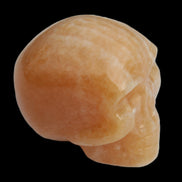 Banded Yellow Calcite skull 49mm 185.6g in sunlight - Rocks and Things Store