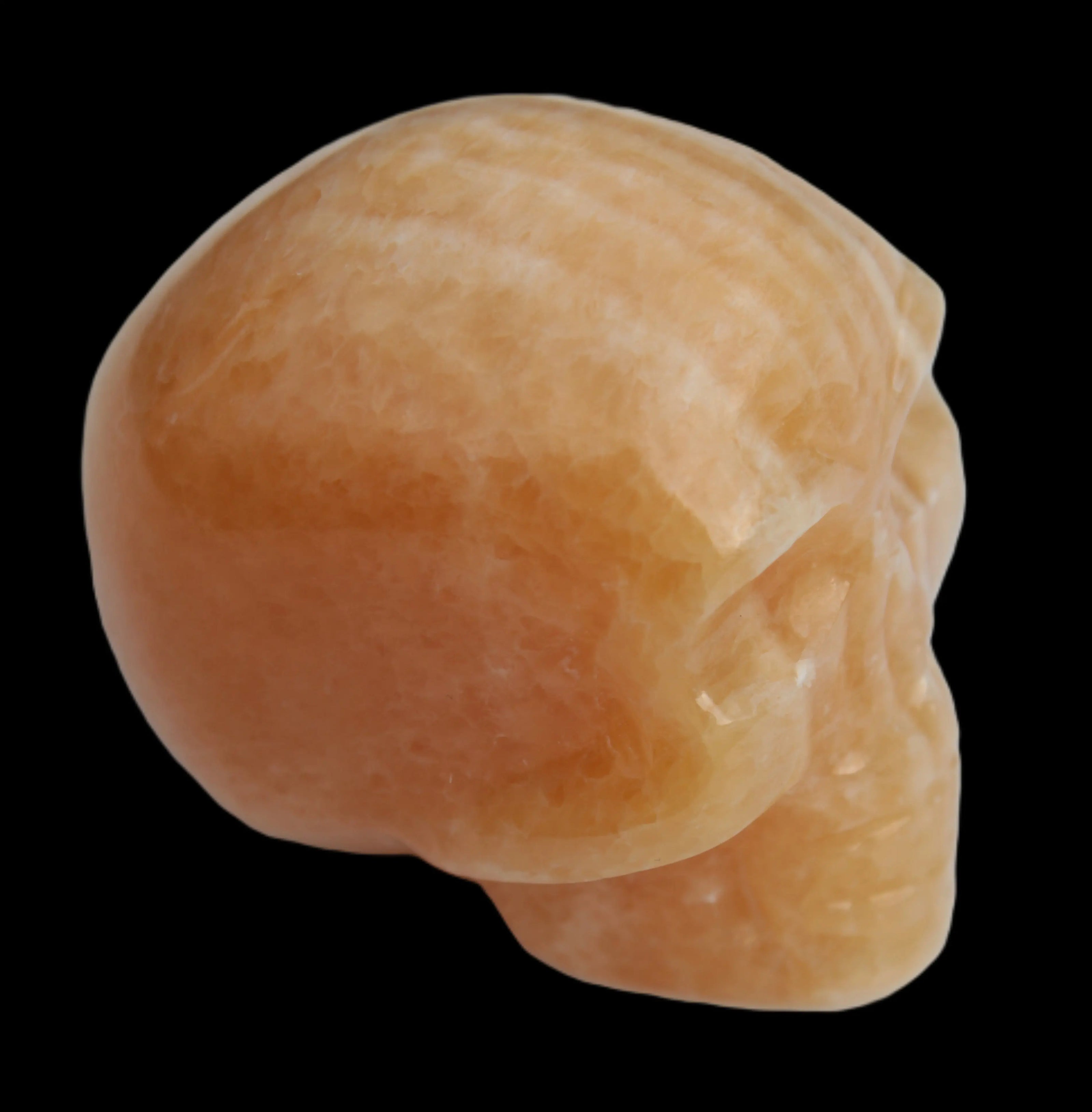 Banded Yellow Calcite skull 49mm 185.6g in sunlight - Rocks and Things Store
