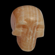 Banded Yellow Calcite skull 49mm 185.6g in sunlight - Rocks and Things Store