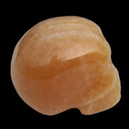 Banded Yellow Calcite skull 49mm 185.6g in sunlight - Rocks and Things Store