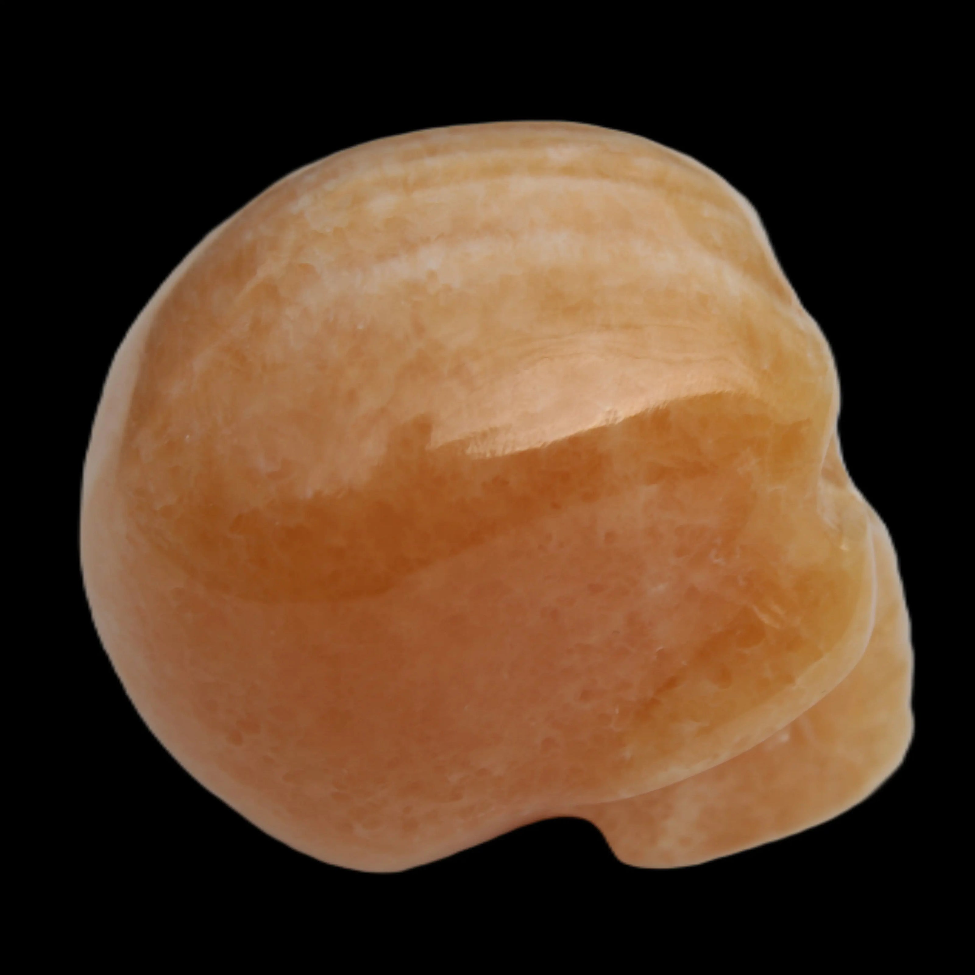 Banded Yellow Calcite skull 49mm 185.6g in sunlight - Rocks and Things Store