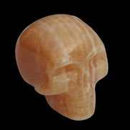 Banded Yellow Calcite skull 49mm 185.6g in sunlight - Rocks and Things Store