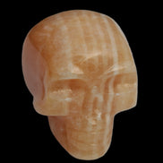 Banded Yellow Calcite skull 49mm 185.6g in sunlight - Rocks and Things Store