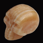 Banded Yellow Calcite skull 49mm 185.6g in sunlight - Rocks and Things Store