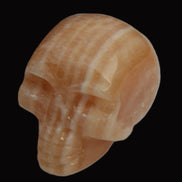 Banded Yellow Calcite skull 49mm 185.6g in sunlight - Rocks and Things Store