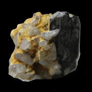 Black Tourmaline with Feldspar Quartz UV reactive matrix 88.2ct 17.7g in LED light -  Rocks and Things Store