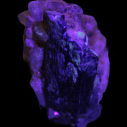 Black Tourmaline with Feldspar Quartz UV reactive matrix 88.2ct 17.7g in UV light - Rocks and Things Store