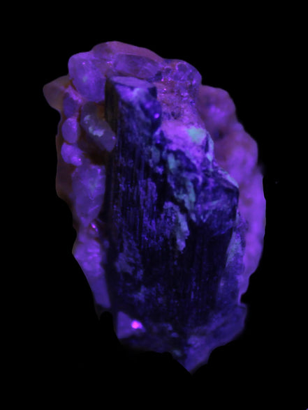 Black Tourmaline with Feldspar Quartz UV reactive matrix 88.2ct 17.7g in UV light - Rocks and Things Store