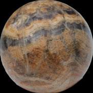 Bumblebee Calcite sphere 80g in sunlight - Rocks and Things Store