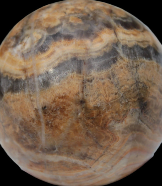 Bumblebee Calcite sphere 80g in sunlight - Rocks and Things Store