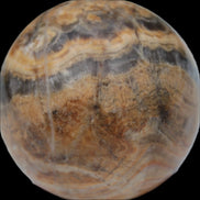 Bumblebee Calcite sphere 80g in sunlight - Rocks and Things Store