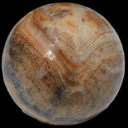 Bumblebee Calcite sphere 80g in sunlight - Rocks and Things Store