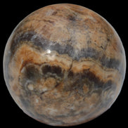 Bumblebee Calcite sphere 80g in sunlight - Rocks and Things Store