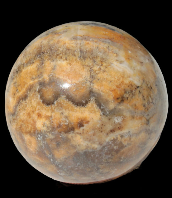 Calcite banded sphere 180g in sunlight - Rocks and Things Store