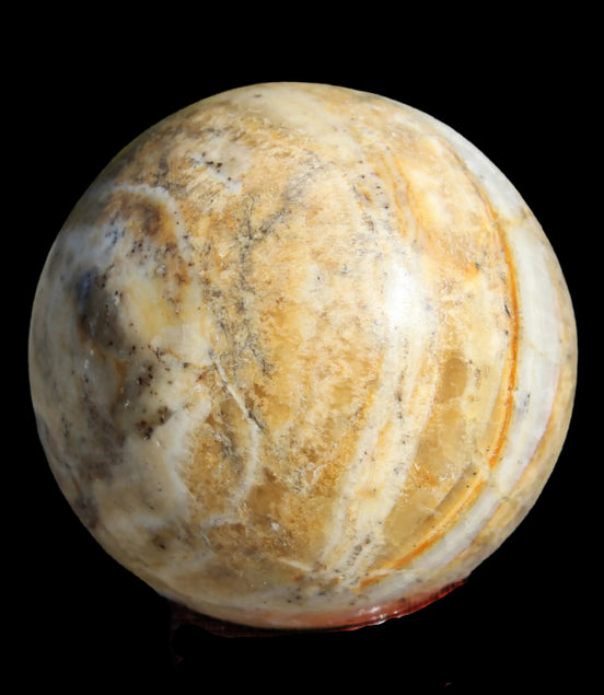 Calcite banded sphere 180g in sunlight - Rocks and Things Store