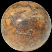 Calcite banded sphere 180g in sunlight - Rocks and Things Store