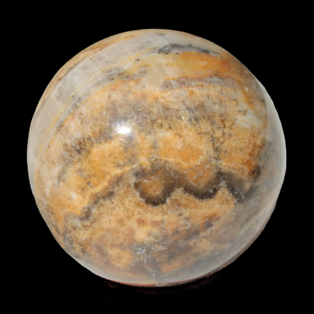 Calcite banded sphere 180g in sunlight - Rocks and Things Store