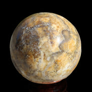 Calcite banded sphere 180g in sunlight - Rocks and Things Store