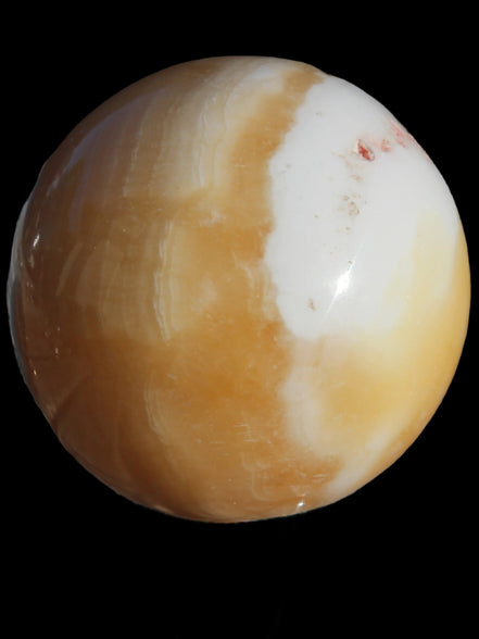 Calcite sphere 582g in sunshine - Rocks and Things Store