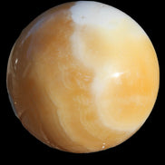 Calcite sphere 582g in sunshine - Rocks and Things Store