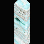 Aqua Blue Caribbean Calcite obelisk 292g in sunight - Rocks and Things Store