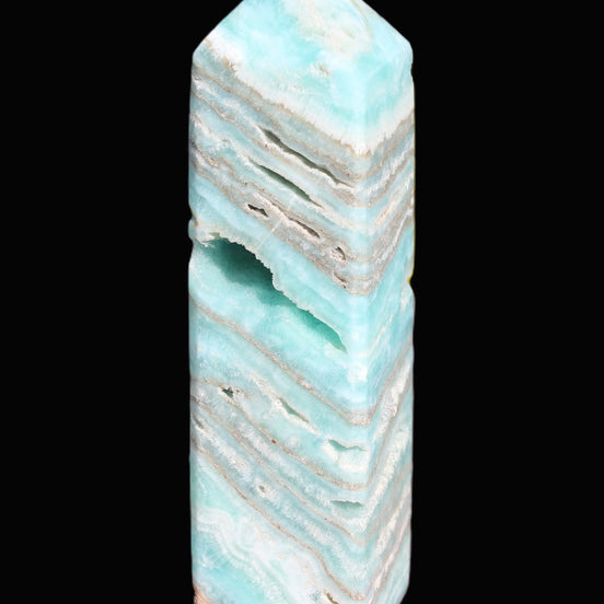 Aqua Blue Caribbean Calcite obelisk 292g in sunight - Rocks and Things Store