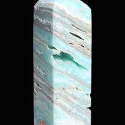 Aqua Blue Caribbean Calcite obelisk 292g in sunight - Rocks and Things Store