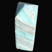 Aqua Blue Caribbean Calcite obelisk 292g in sunight - Rocks and Things Store