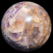 Chevron Fantasy Amethyst sphere 1424g in sunlight - Rocks and Things Store