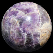 Chevron Fantasy Amethyst sphere 1424g in sunlight - Rocks and Things Store