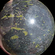 Green Plum Blossom Jade sphere 132mm 3460g in sunlight - Rocks and Things Store