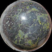 Green Plum Blossom Jade sphere 132mm 3460g in sunlight - Rocks and Things Store
