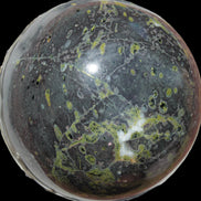 Green Plum Blossom Jade sphere 132mm 3460g in sunlight - Rocks and Things Store