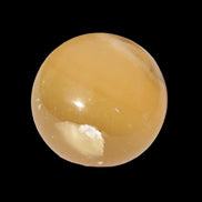 Honey Calcite sphere 47mm 162g in sunlight - Rocks and Things Store