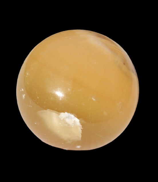 Honey Calcite sphere 47mm 162g in sunlight - Rocks and Things Store