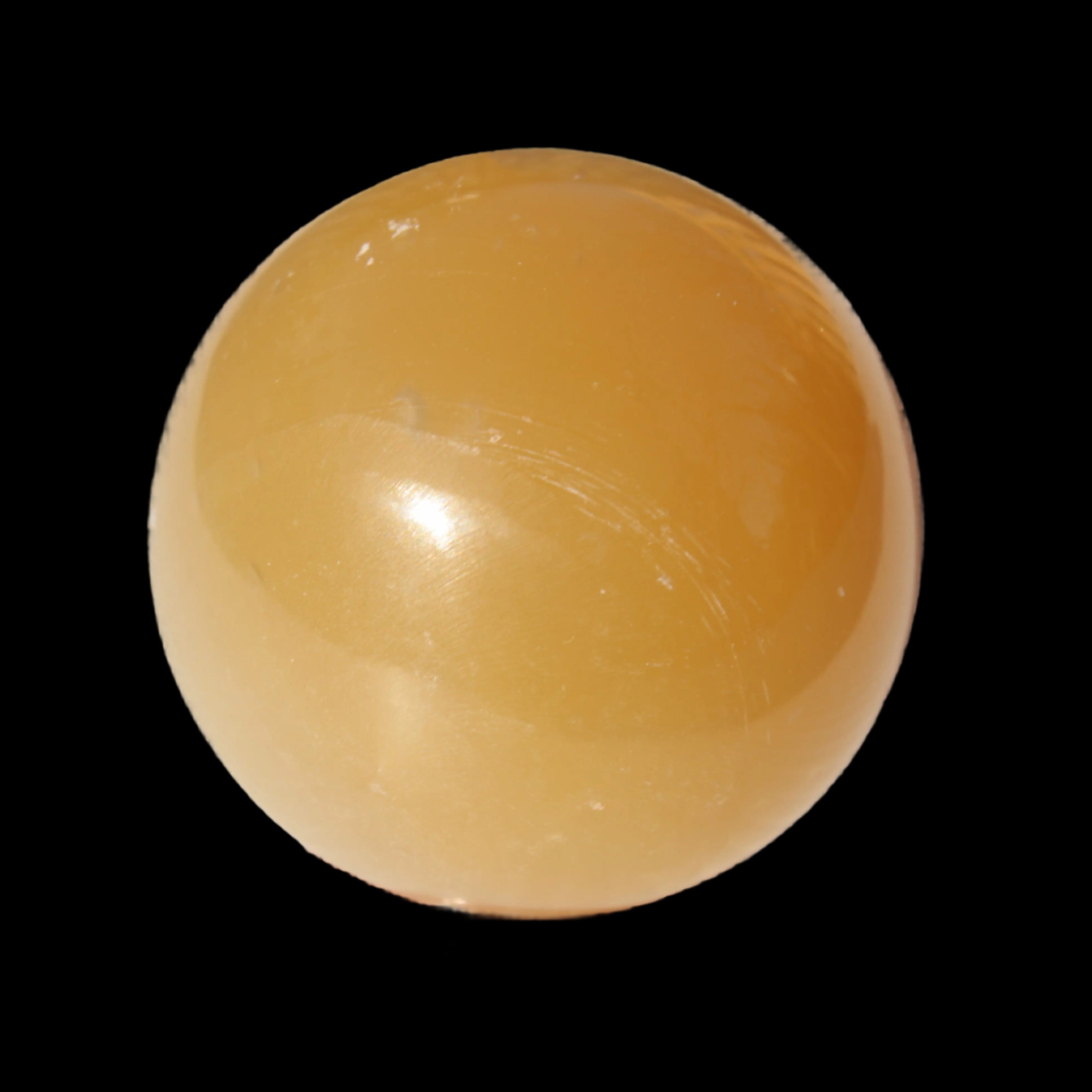 Honey Calcite sphere 47mm 162g in sunlight - Rocks and Things Store