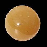 Honey Calcite sphere 47mm 162g in sunlight - Rocks and Things Store