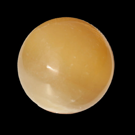 Honey Calcite sphere 47mm 162g in sunlight - Rocks and Things Store