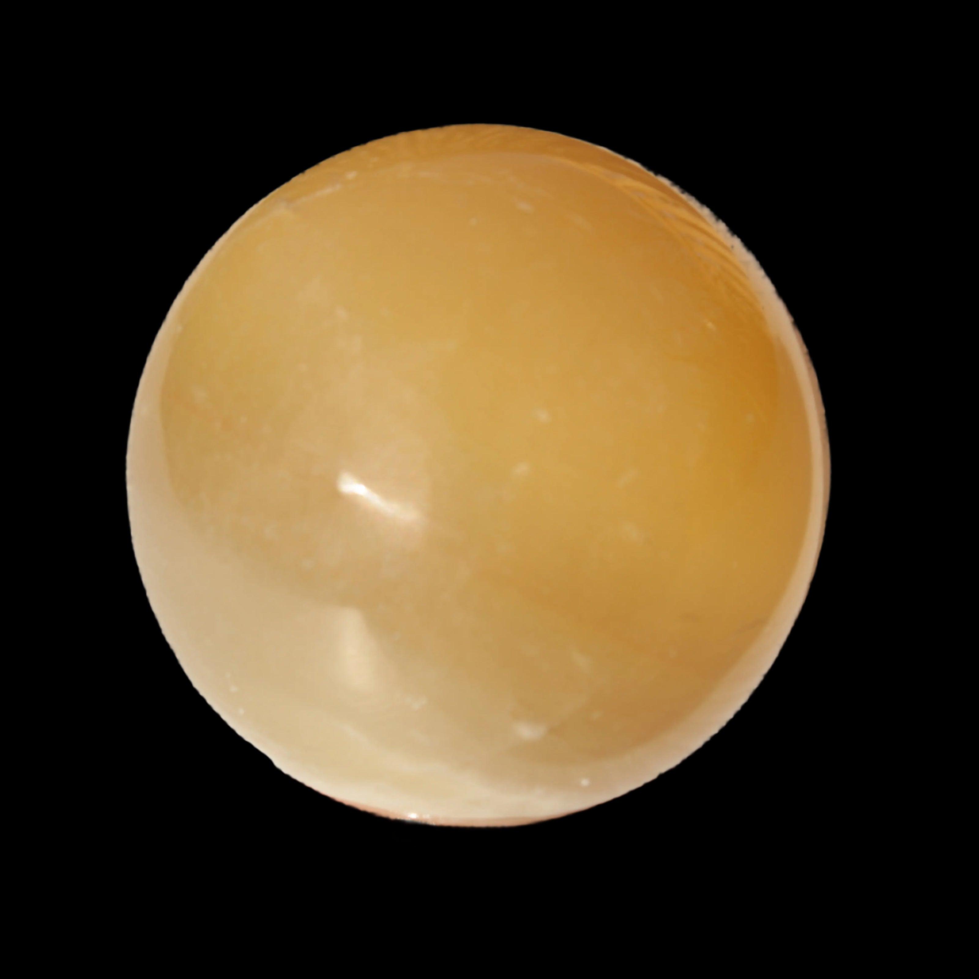 Honey Calcite sphere 47mm 162g in sunlight - Rocks and Things Store