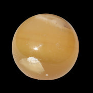 Honey Calcite sphere 47mm 162g in sunlight - Rocks and Things Store