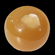 Honey Calcite sphere 47mm 162g in sunlight - Rocks and Things Store